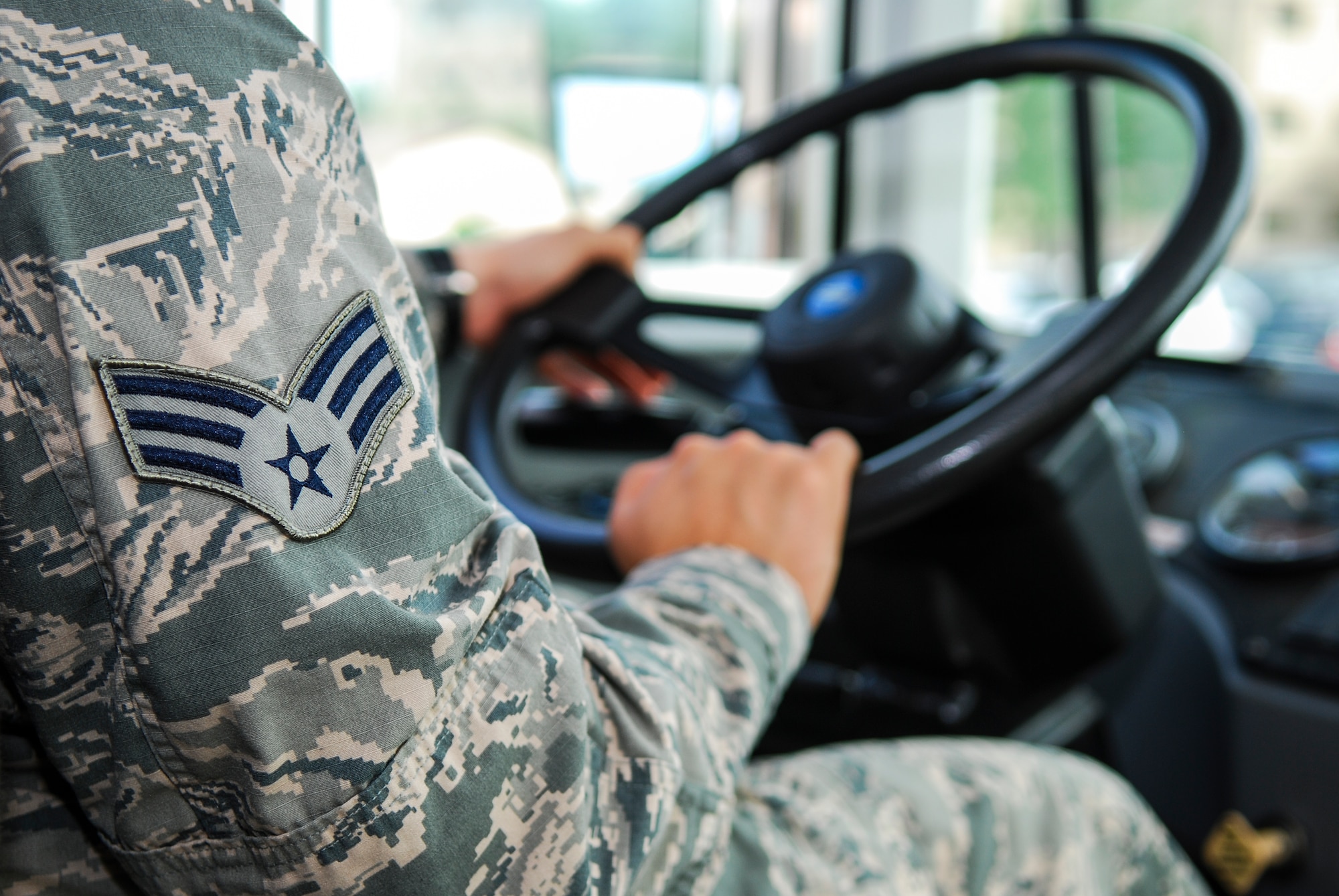 Senior Airman Jack Cortez, 374th Logistical Readiness Squadron vehicle operator, drives augmentees around base at Osan Air Base, South Korea, during Ulchi Freedom Guardian, Aug. 25, 2014. Cortez transported more than 200 military members to various locations around base during his 4-hour-a-day shift work. (U.S. Air Force photo by Senior Airman Racheal E. Watson/Released) 