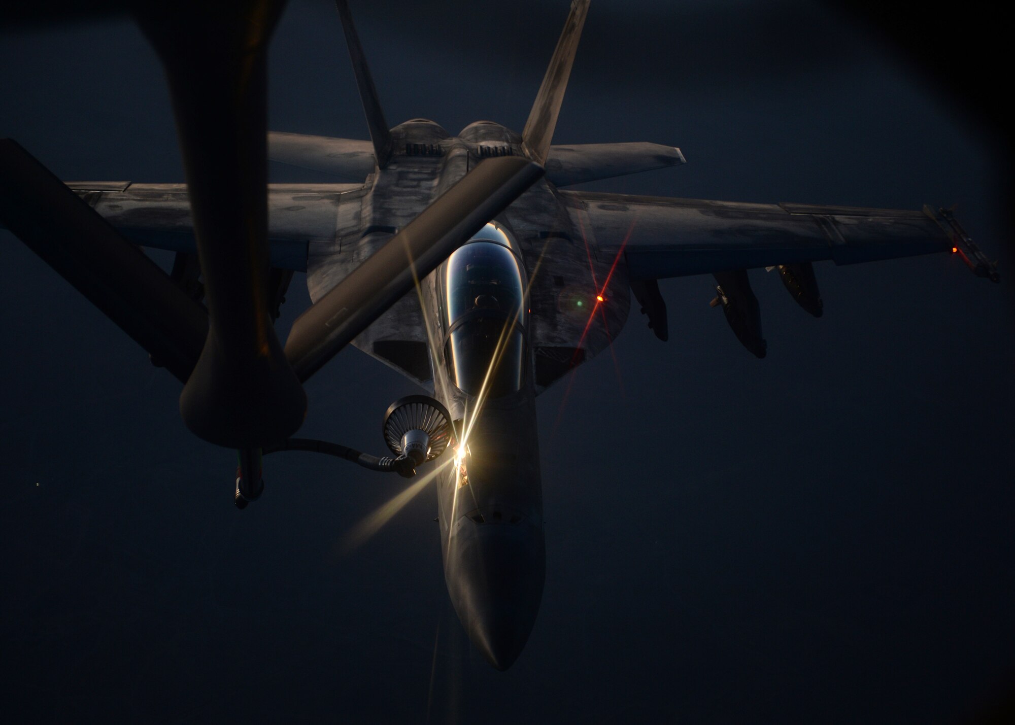 MIDDLE EAST - An U.S. fighter jet refuels from an Air Force KC-135 Stratotanker Aug. 21.  (U.S. Air Force photo by Staff Sgt. Shawn Nickel)