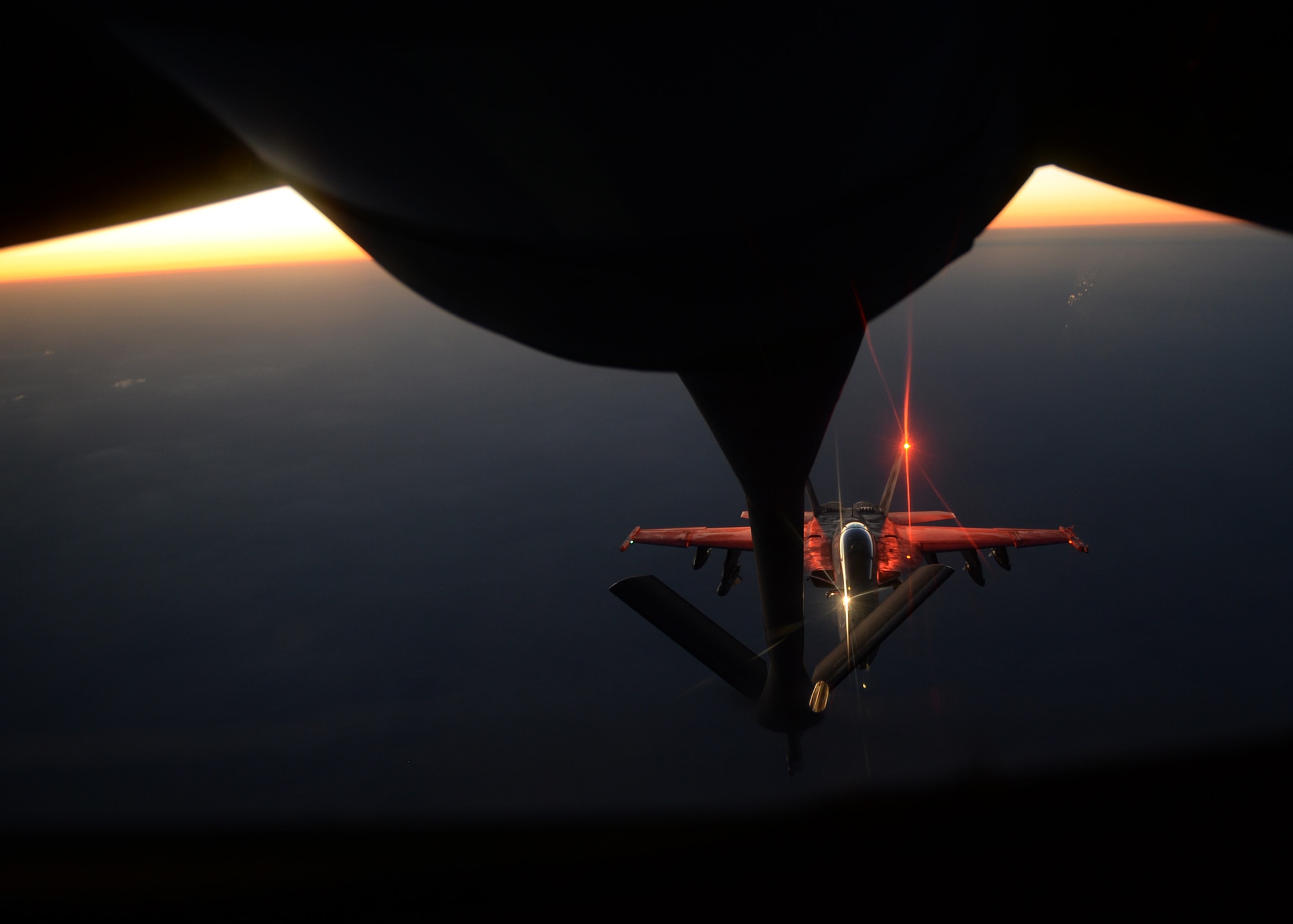 MIDDLE EAST - An U.S. fighter jet refuels from an Air Force KC-135 Stratotanker Aug. 21.  (U.S. Air Force photo by Staff Sgt. Shawn Nickel)