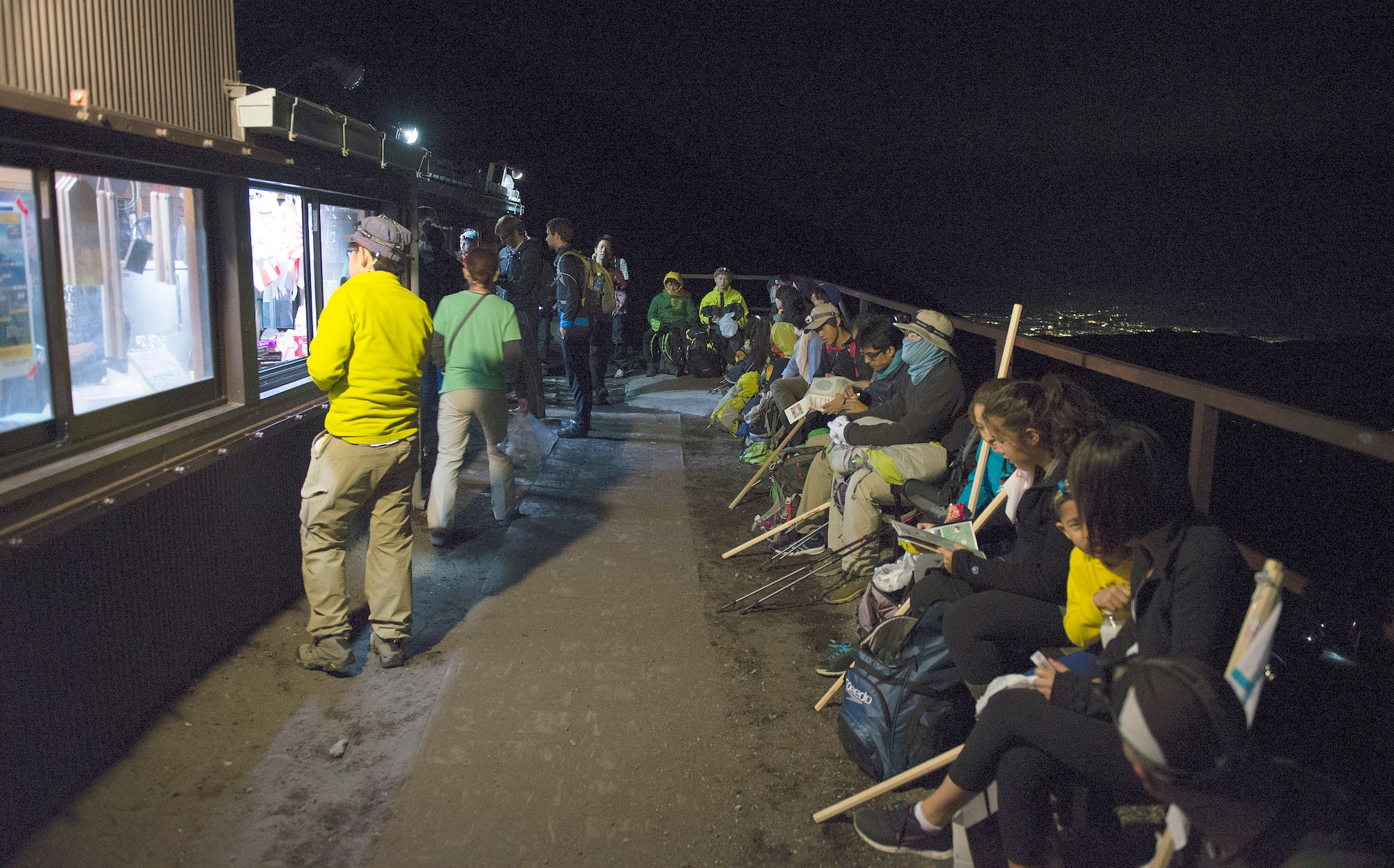 There are a number of stations and sub-stations along the Yoshida Trail on Mount Fuji, Japan, that cater to hikers by selling stamps for the souvenir walking sticks, food, and drinks.  Mount Fuji is the most popular tourist sight in Japan; more than 200,000 people climb to the summit every year. (U.S. Air Force photo by Tech. Sgt. Christopher Marasky/Released)