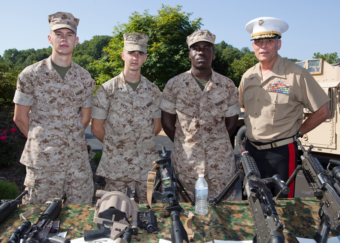 The Assistant Commandant of the Marine Corps, Gen. John M. Paxton, Jr., poses for a photo with guests participating in the Missouri Friends of Injured Marines Golf Tourney held at St. Albans Country Club, St. Albans, Mo., Aug. 24, 2014. (U.S. Marine Corps photo by Cpl. Tia Dufour/Released)