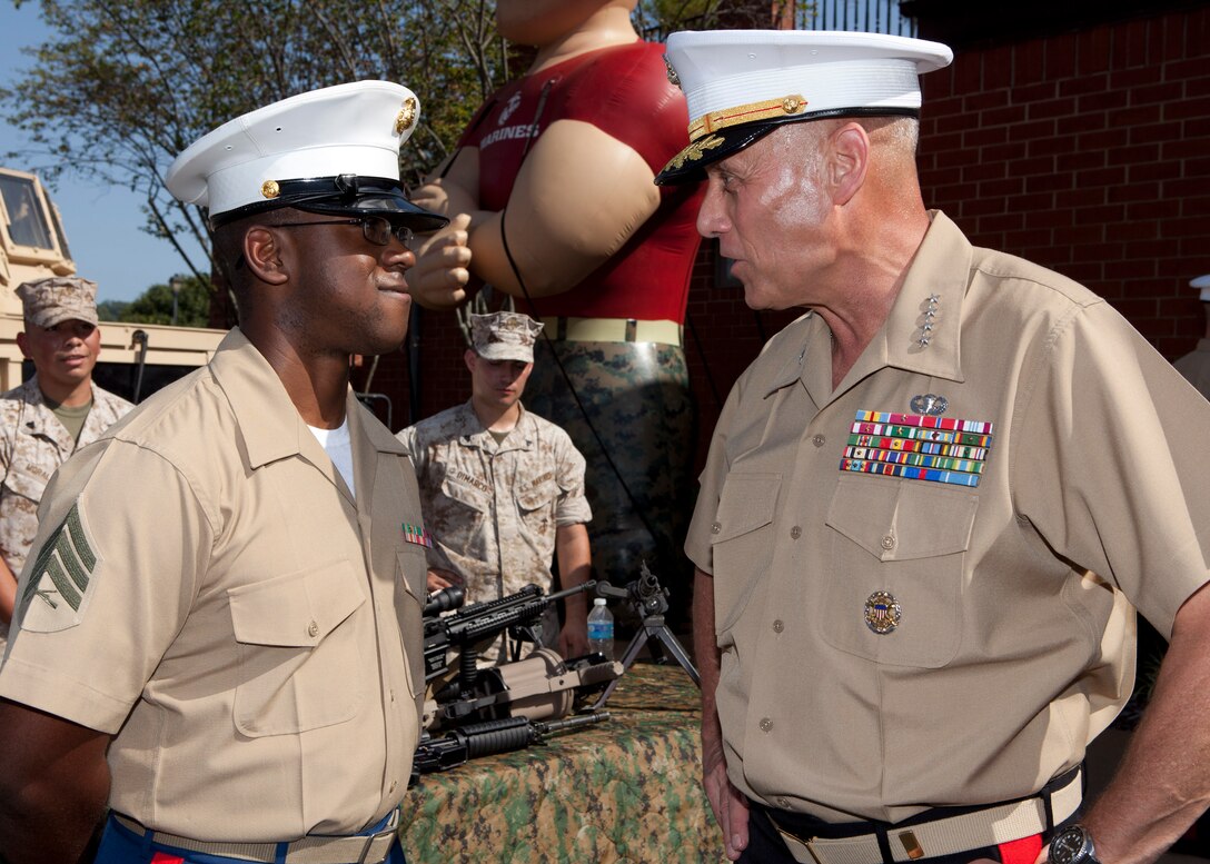 The Assistant Commandant of the Marine Corps, Gen. John M. Paxton, Jr., poses for a photo with guests participating in the Missouri Friends of Injured Marines Golf Tourney held at St. Albans Country Club, St. Albans, Mo., Aug. 24, 2014. (U.S. Marine Corps photo by Cpl. Tia Dufour/Released)