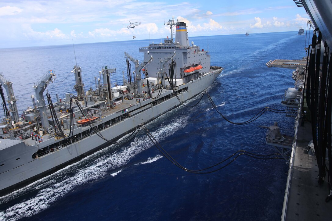 The USNS Rappahannock refuels the USS Makin Island during a replenishment at sea (RAS) as part of the 11th Marine Expeditionary Unit’s WESTPAC 14-2 deployment Aug. 24, 2014. The 11th MEU and Makin Island Amphibious Ready Group are deployed to the U.S. 7th Fleet area of operations as a sea based, expeditionary crisis response force capable of conducting amphibious missions across the full range of military operations. (U.S. Marine Corps photo by Cpl. Demetrius Morgan/RELEASED) 