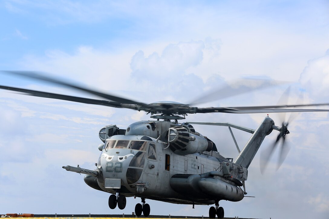 A CH-53E Super Stallion with Marine Medium Tiltrotor Squadron 163 (Reinforced), 11th Marine Expeditionary Unit, takes off from the flight deck of the USS Comstock  Aug. 25. The 11th MEU and Makin Island Amphibious Ready Group are deployed to the U.S. 7th Fleet area of operations as a sea-based, expeditionary crisis response force capable of conducting amphibious missions across the full range of military operations. (U.S. Marine Corps photo by Sgt. Melissa Wenger/Released) 