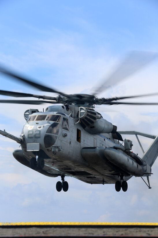A CH-53E Super Stallion with Marine Medium Tiltrotor Squadron 163 (Reinforced), 11th Marine Expeditionary Unit, takes off from the flight deck of the USS Comstock during their deployment Aug. 25. The 11th MEU and Makin Island Amphibious Ready Group are deployed to the U.S. 7th Fleet area of operations as a sea-based, expeditionary crisis response force capable of conducting amphibious missions across the full range of military operations. (U.S. Marine Corps photo by Sgt. Melissa Wenger/Released) 
