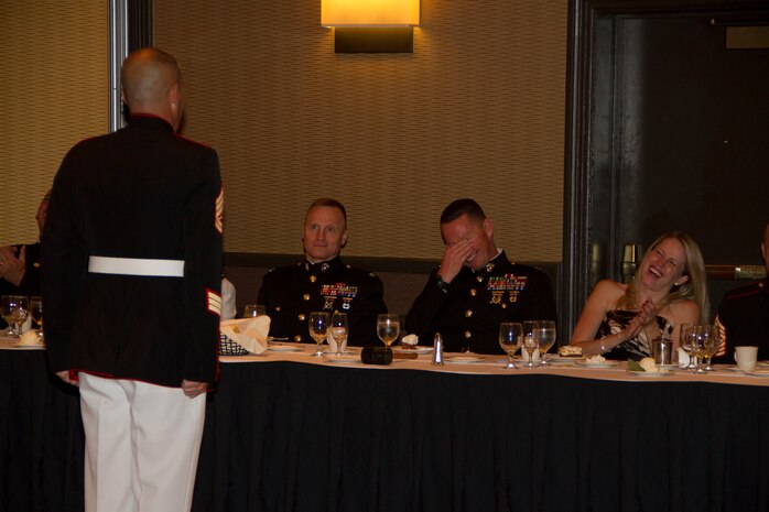 The head table reacts to Gunnery Sgt. Joshua Krause’s, the Logistics Chief of Recruiting Station Milwaukee, rebuttal of the fine levied against him during RS Milwaukee’s first Dining Out, Aug. 20 in Brown Deer, Wis. 