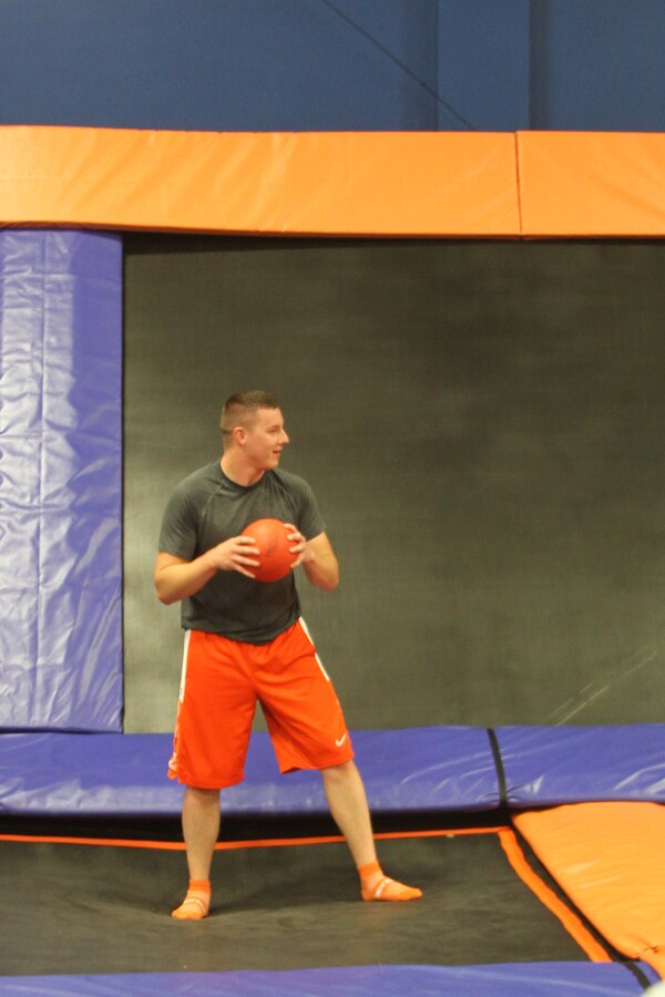 U.S. Marine Corps Cpl. Tyler Birky, a combat photographer for the 4th Marine Corps District and native of Bend, Ore., prepares to throw a ball during a game of dodgeball at Sky Zone in Camp Hill, Pa., Aug. 22, 2014. The 4MCD noncommissioned officers went to Sky Zone to build camaraderie with the goal of increasing the effectiveness of the district in the recruiting effort. (U.S. Marine Corps photo by Cpl. Kyle Welshans/Released)