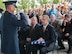 Maj. Gen. Gary Sayler presents the American flag to Brad Fisher during the interment ceremony for the late Col. Bernard Fisher, a Medal of Honor recipient, Aug. 25, 2014, at Idaho State Veterans Cemetery, Boise, Idaho. While assigned to the 1st Air Commando Squadron at Pleiku, South Vietnam, he received nationwide publicity for his actions during the battle of A Shau Valley in which he rescued a downed pilot by landing his A-1E Skyraider on a shrapnel-ridden runway and under heavy ground fire. (U.S. Air Force photo/Airman 1st Class Malissa Lott) 