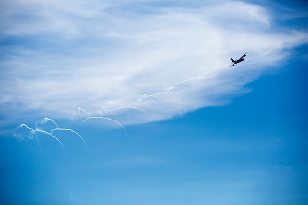 A KC-130J Super Hercules pops MJU-61 infrared flare counter measures during a threat reaction evolution on an island outside of Okinawa, Japan, Aug. 26, 2014. The threat reaction evolution is a chance for pilots to stay up to date on their qualifications while keeping an alert and aware mindset for any arising combat scenario.