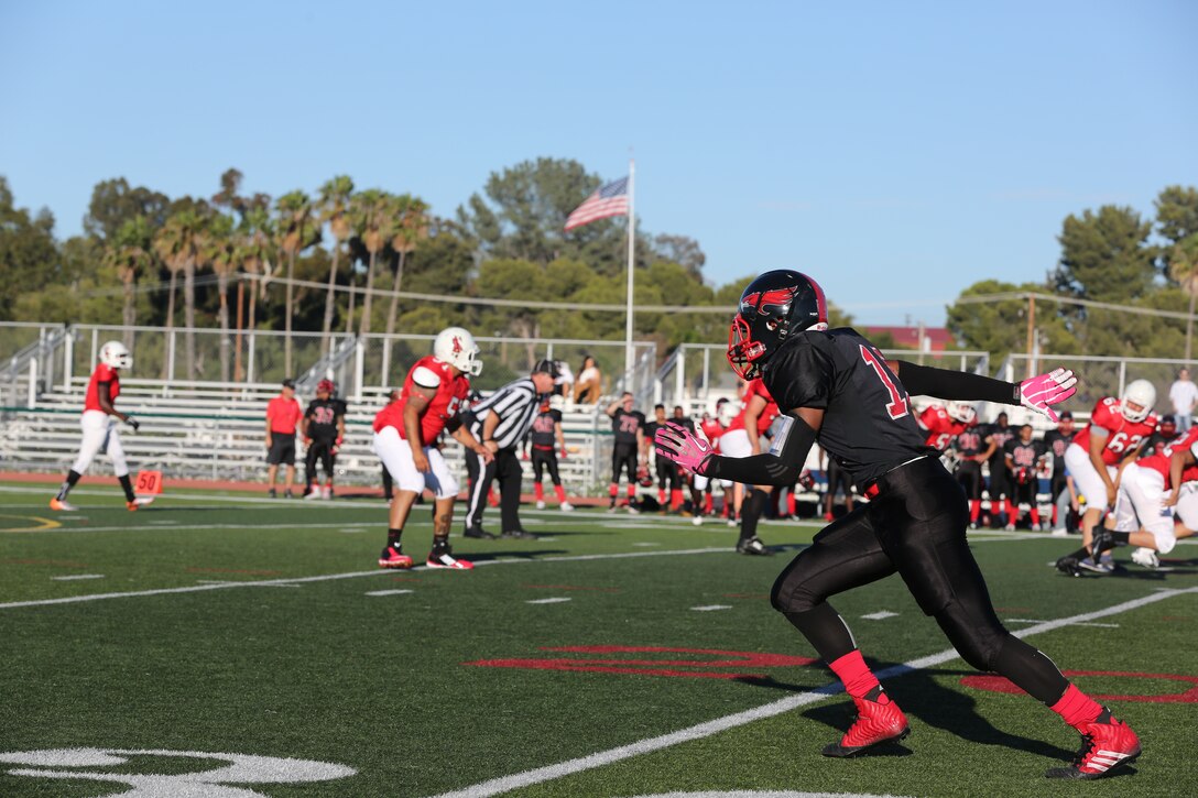 Jabari Moore, Marine Corps Air Station Miramar Falcons’ wide receiver, explodes off the line of scrimmage during a game against the Headquarters Battalion, 1st Marine Division Standard Bearers at Paige Field House aboard Marine Corps Base Camp Pendleton, Calif., Aug. 26. The Falcons defeated the Standard Bearers 19-8 in their season opener and are set to face the 3rd Assault Amphibian Battalion Gators Sept. 9 at 5 p.m. at Paige Field House.