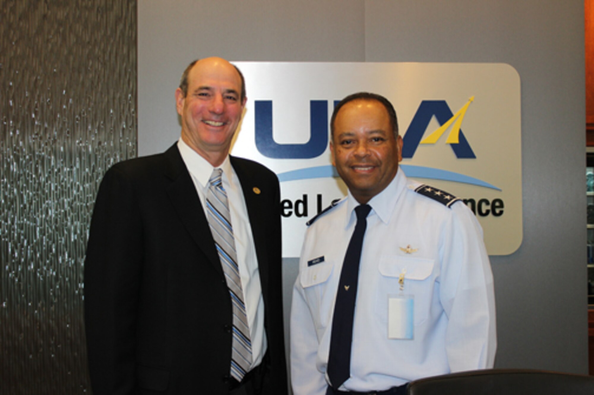 Lt. Gen. Sam Greaves, commander of Air Force Space Command's Space and Missile Systems Center, is greeted by Michael Glass, president and CEO emeritus of ULA, in Decatur, Ala., on August 26, prior to a Quality Summit. (Photo courtesy of ULA) 
