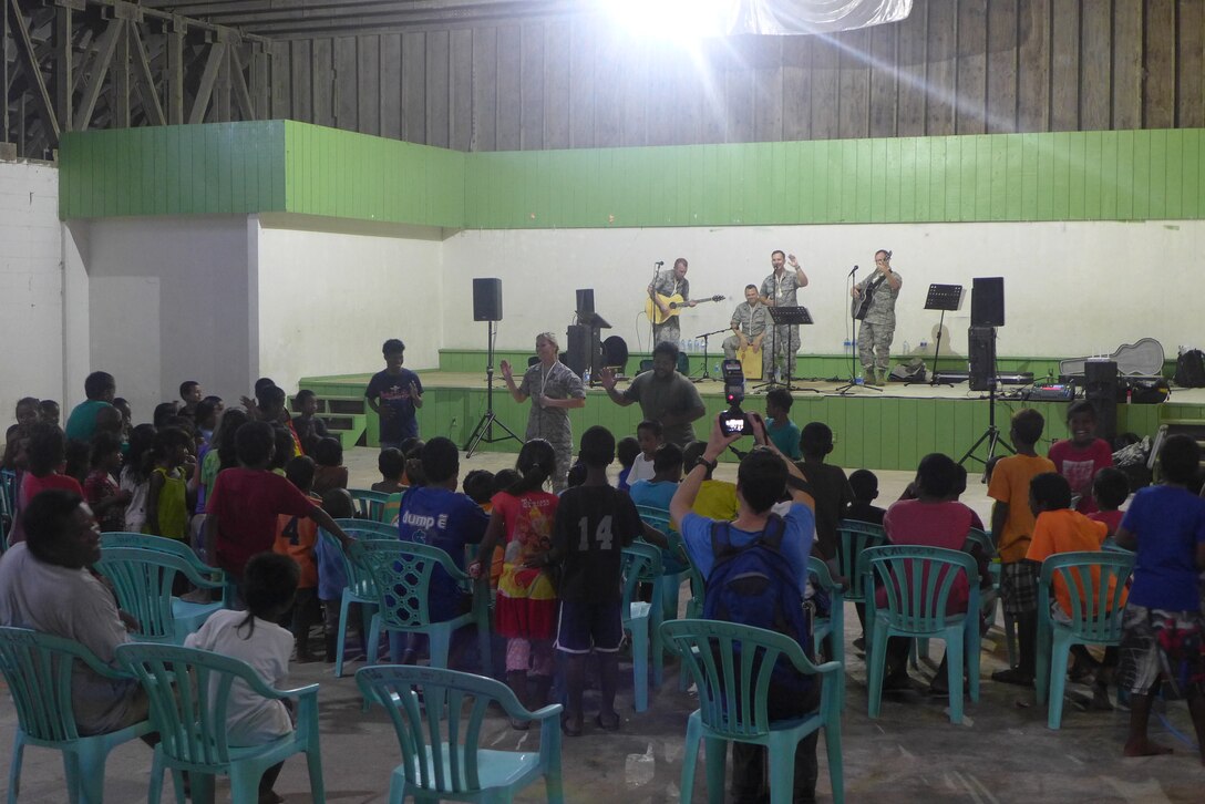 EBEYE,The Marshall Islands--  "Small Kine" taught a new dance to the people of Ebeye, Aug. 16, 2014. Hundreds of people gathered in the Community Center to hear "Small Kine". It was a fun night, filled with dancing, singing, and games! 
(A.F. Photo by TSgt Michael Smith/released)