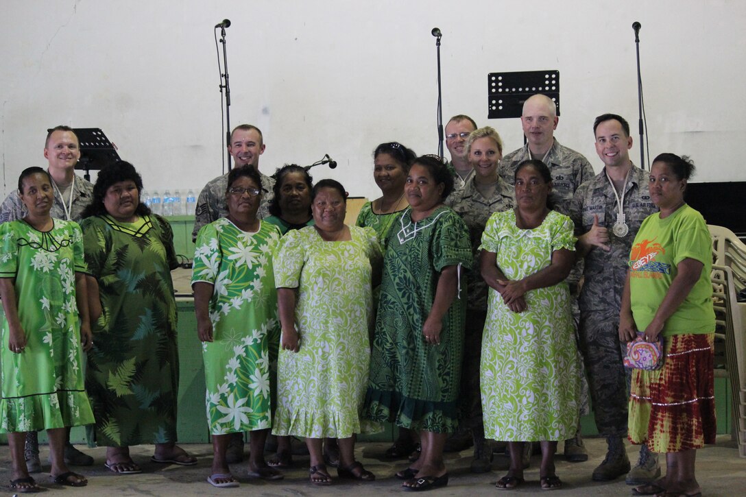 EBEYE,The Marshall Islands--  "Small Kine" performed on the third most densely populated island in the world, Ebeye, Aug. 16, 2014. The band posed for a group photo with some of the local woman, before the show.  
(A.F. Photo by TSgt Michael Smith/released)