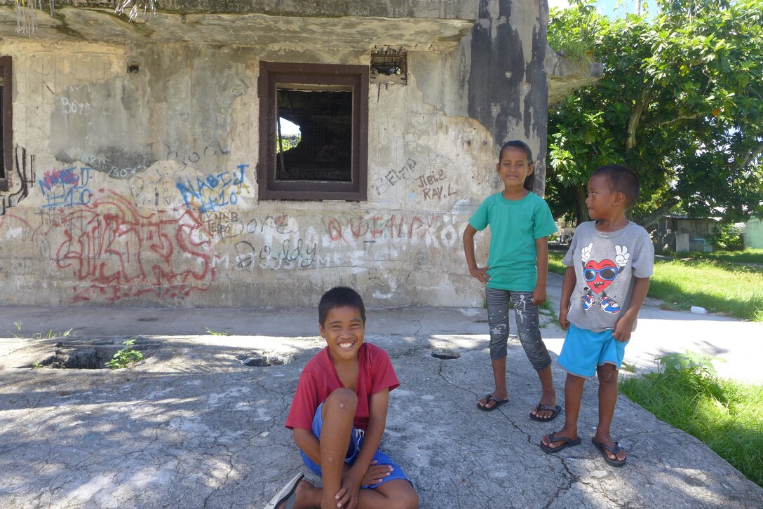 ENNUBIRR ISLAND,The Marshall Islands-- Marshallese children, hanging out after the "Small Kine" performance, Aug. 15, 2014. "Small Kine" was the first live band to ever play on this small island, since there isn't any power or running water. "Small Kine" came prepared with a generator and a very talented audio engineer, TSgt Michael Smith! 
(A.F. Photo by TSgt Michael Smith/released)