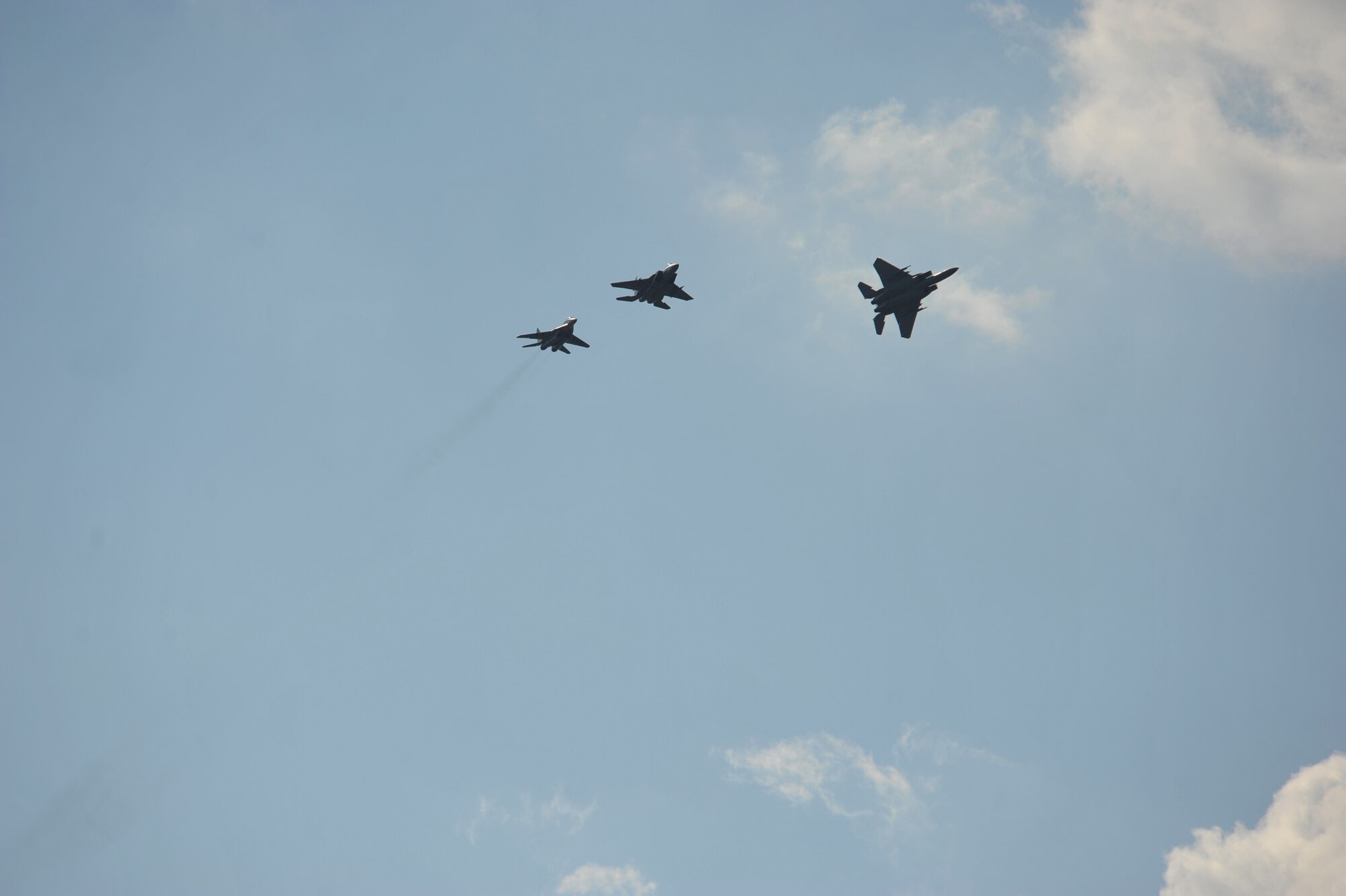 Two F-15C Eagles and one Bulgarian aircraft (left) prepare to land after training together in the skies of Bulgaria Aug. 18, 2014. Pilots, maintainers and a mixture of other professions from Royal Air Force Lakenheath, England, as well as Airmen from Ramstein Air Base, Germany, will enhance interoperability with Bulgaria and maintain joint readiness. (U.S. Air Force photo/Senior Airman Hailey Haux)
