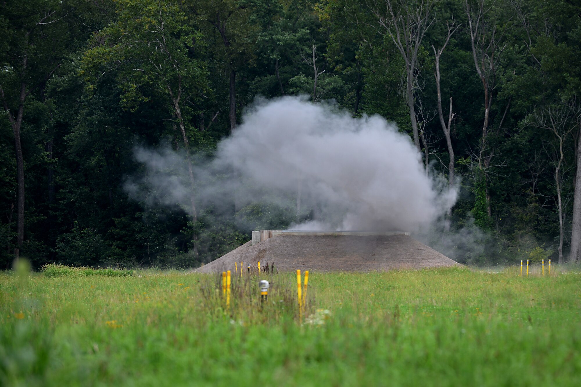 An explosive detonates at the Explosive Ordnance Proficiency Range Aug. 22, 2014, at Scott Air Force Base, Ill. The EOD unit is in the process of trying to get hands-on training like this once to twice a month. (U.S. Air Force photo/Senior Airman Jake Eckhardt)