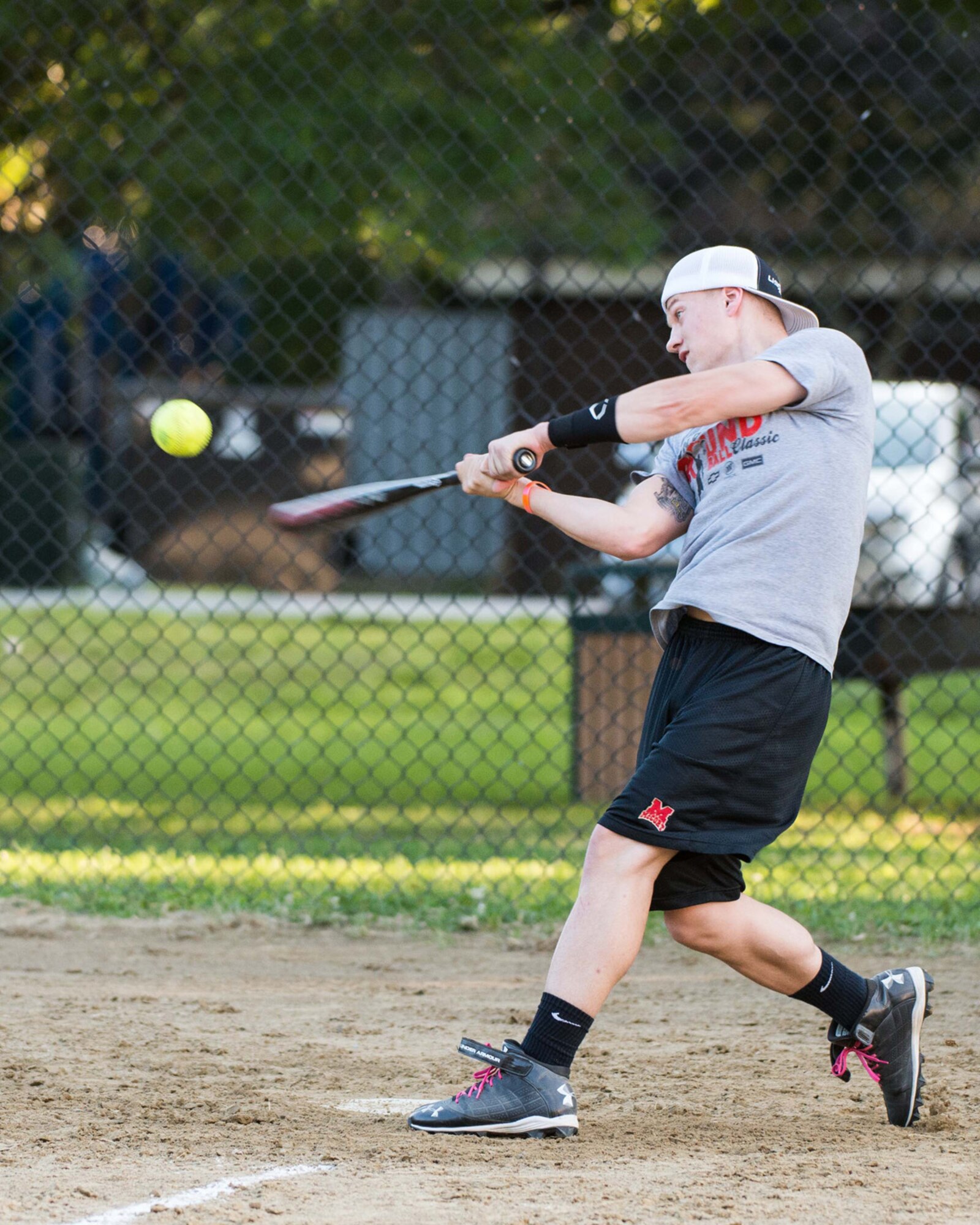 HANSCOM AIR FORCE BASE, Mass. – Airman 1st Class Randy Hodgson, a member of the 66th Air Base Group softball team, takes a swing during the championship game against the Massachusetts Institute of Technology Lincoln Laboratory team Aug. 26 on a softball field on base. MIT Lincoln Library went on to win the championship game by a score of 23 to14 to win this year’s championship trophy. (U.S. Air Force photo by Mark Herlihy)