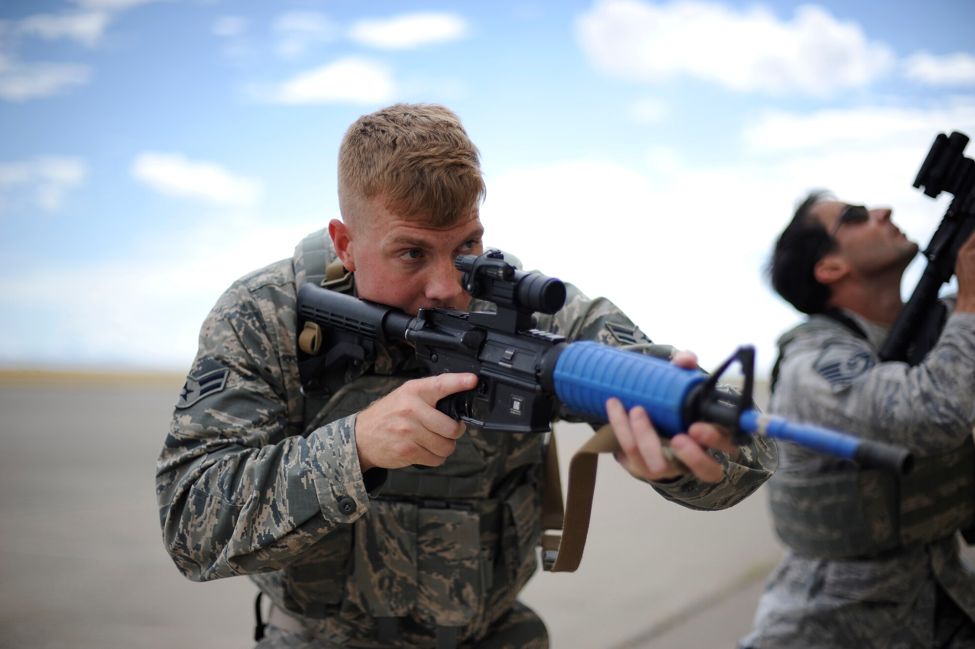 Airman 1st Class William Lamb, 341st Missile Security Forces Squadron member, simulates engaging possible threats during a training exercise at Malmstrom’s shoot house Aug. 14. Malmstrom’s security forces team members are training to participate in the Global Strike Challenge, which is a contest to recognize the hard working and dedicated personnel of the Air Force Global Strike Command by showcasing their skills and teamwork through intense training and performance. (U.S. Air Force photo/Airman 1st Class Collin Schmidt)