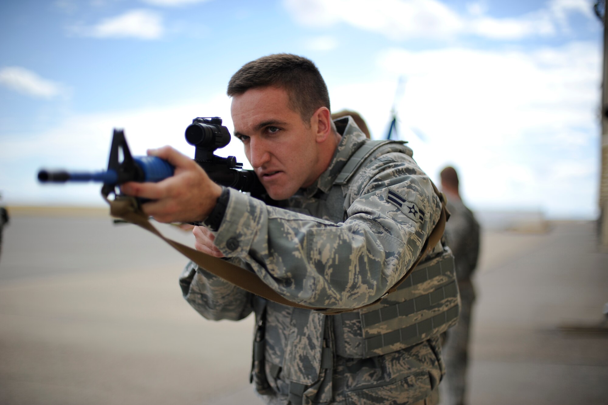 Airman 1st Class Scott Townsend, 341st Missile Security Forces Squadron member, simulates engaging possible threats during a training exercise at Malmstrom’s shoot house Aug. 14. In all, more than 450 Airmen will take part in the Global Strike Challenge at various locations across the nation. (U.S. Air Force photo/Airman 1st Class Collin Schmidt)