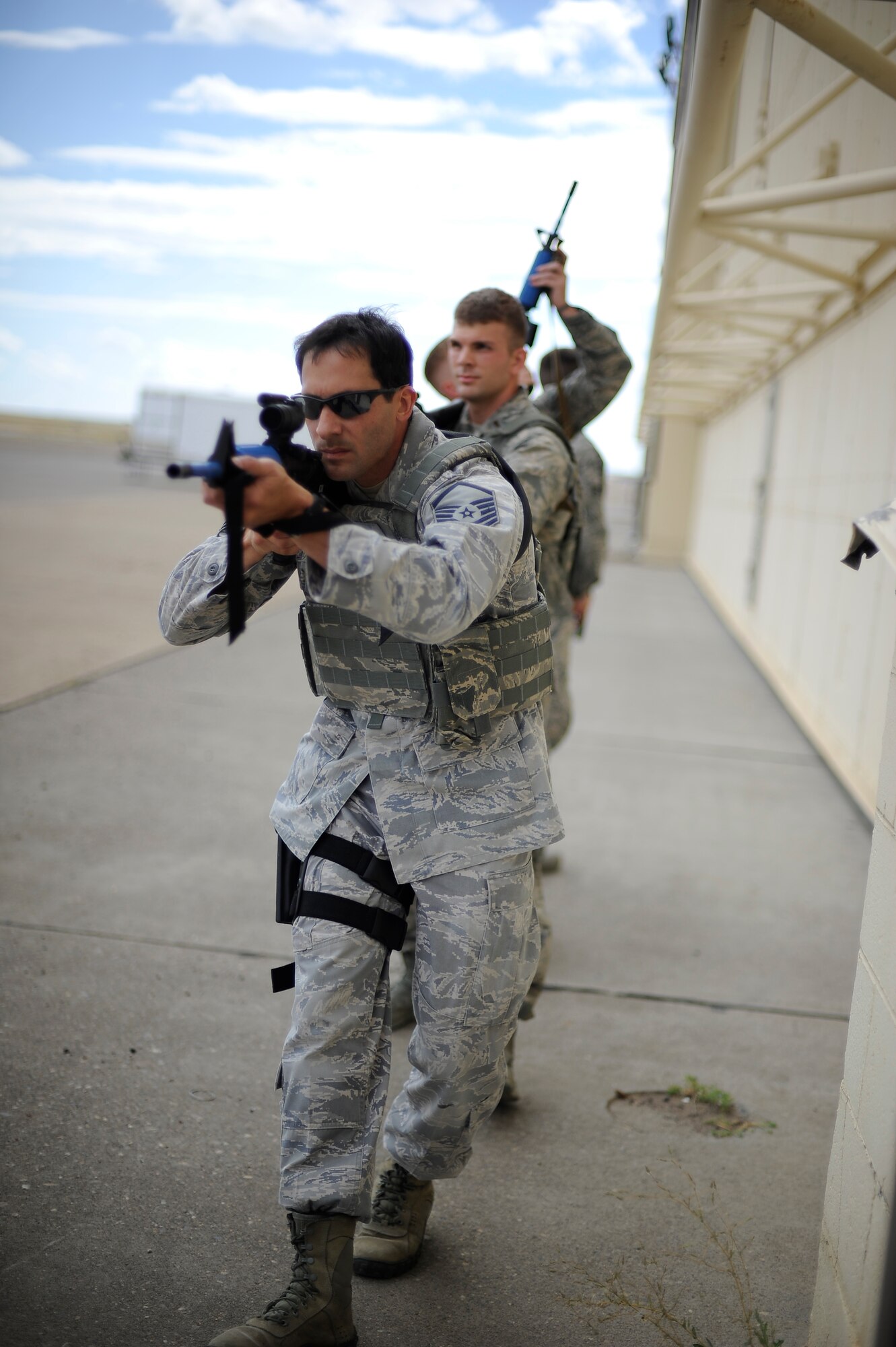 Master Sgt. Todd Vidic, 341st Missile Security Forces Squadron flight chief, takes point during military operations in urban training, otherwise known as a “MOUT” exercise, Aug. 14. In preparation for the Global Strike Challenge, security forces members practice military techniques in urban, close quarters and field settings. (U.S. Air Force photo/Airman 1st Class Collin Schmidt)