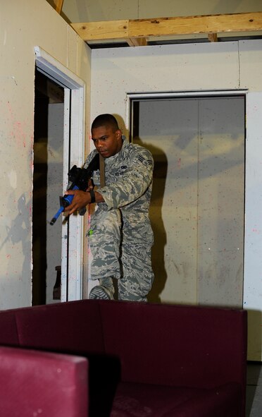 Senior Airman Michael Staley, 341st Missile Security Forces Squadron member, clears a room during a training session at Malmstrom’s shoot house Aug. 14. Staley is one of 10 security forces personnel competing for a final position on Malmstrom’s Global Strike Challenge security forces group team. (U.S. Air Force photo/Airman 1st Class Collin Schmidt)