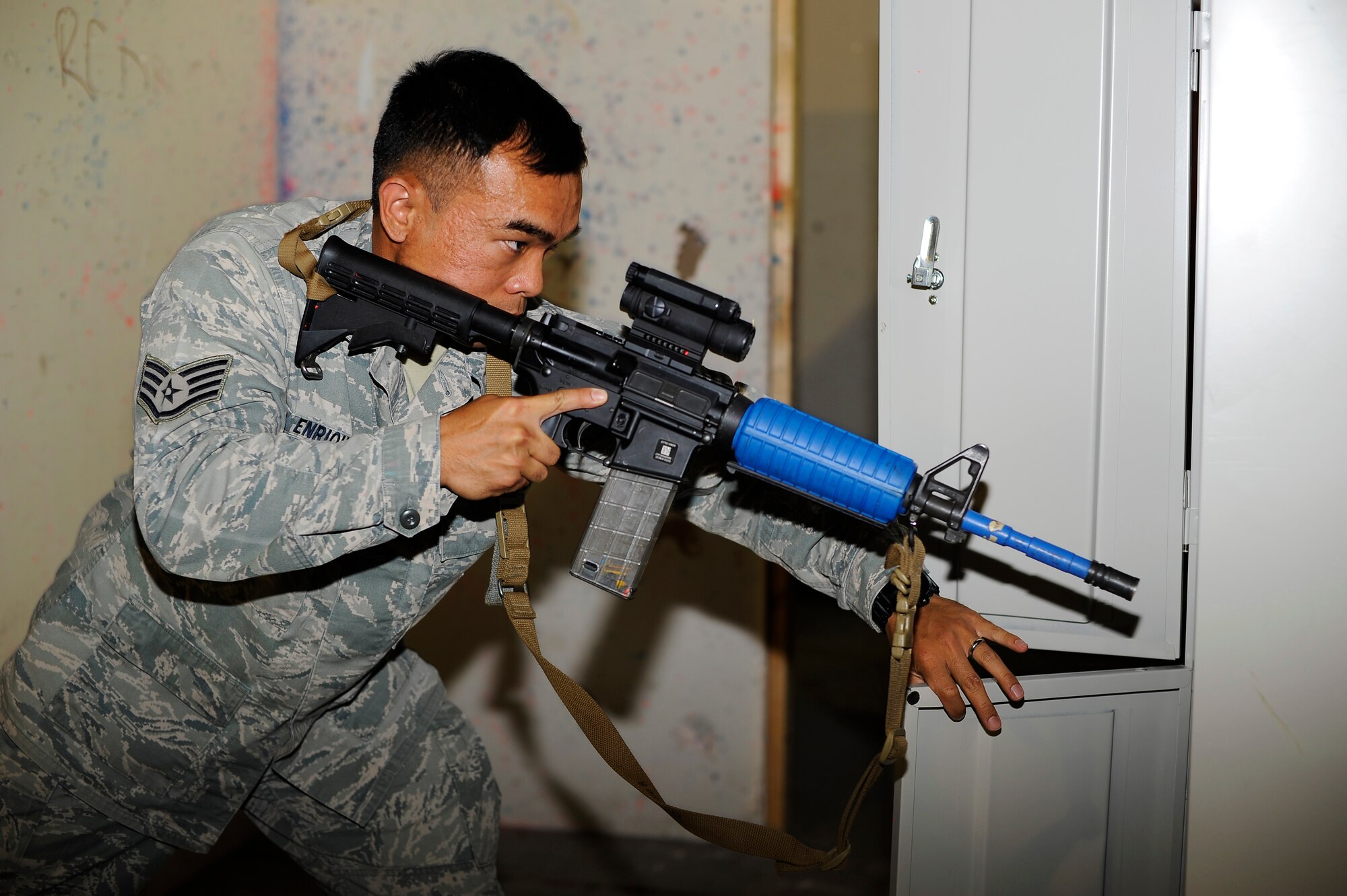 Staff Sgt. Franz Enriquez, 341st Security Forces Group Tactical Response Force assaulter, conducts a detailed search of a room during a training exercise at Malmstrom’s shoot house Aug. 14. During the training, Enriquez also provided secondary searches of rooms previously cleared by security forces members. (U.S. Air Force photo/Airman 1st Class Collin Schmidt)