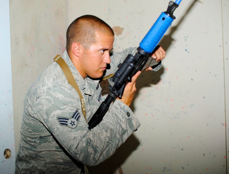 Senior Airman Collin Kleckley, 341st Security Forces Squadron Tactical Response Force member, conducts a rapid tactical reload during a training session at Malmstrom’s shoot house Aug. 14. The training is in preparation for the 2014 Global Strike Challenge wherein the security forces team is competing for the Charlie Fire Team Trophy. (U.S. Air Force photo/Airman 1st Class Collin Schmidt)