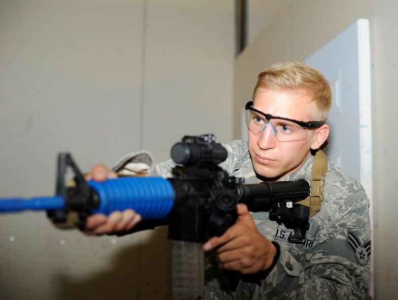 Senior Airman Christopher Elam, 341st Security Forces Group Tactical Response Force member, provides hallway coverage during a training exercise at Malmstrom’s shoot house Aug. 14. During training, security forces members practiced various close-combat techniques in preparation for the 2014 Global Strike Challenge. (U.S. Air Force photo/Airman 1st Class Collin Schmidt)