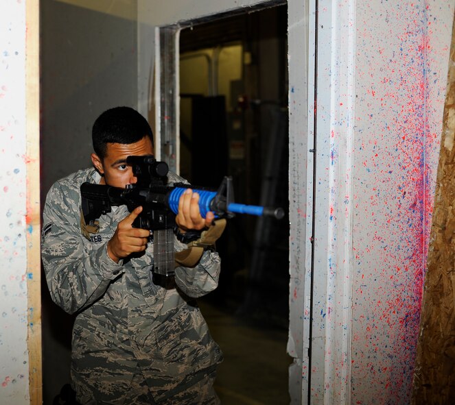 Airman 1st Class Jacob Yates, 341st Security Forces Squadron member, practices close-quarters battle tactics during a training exercise at Malmstrom’s shoot house Aug. 14. The training is in preparation for the 2014 Global Strike Challenge.  (U.S. Air Force photo/Airman 1st Class Collin Schmidt)