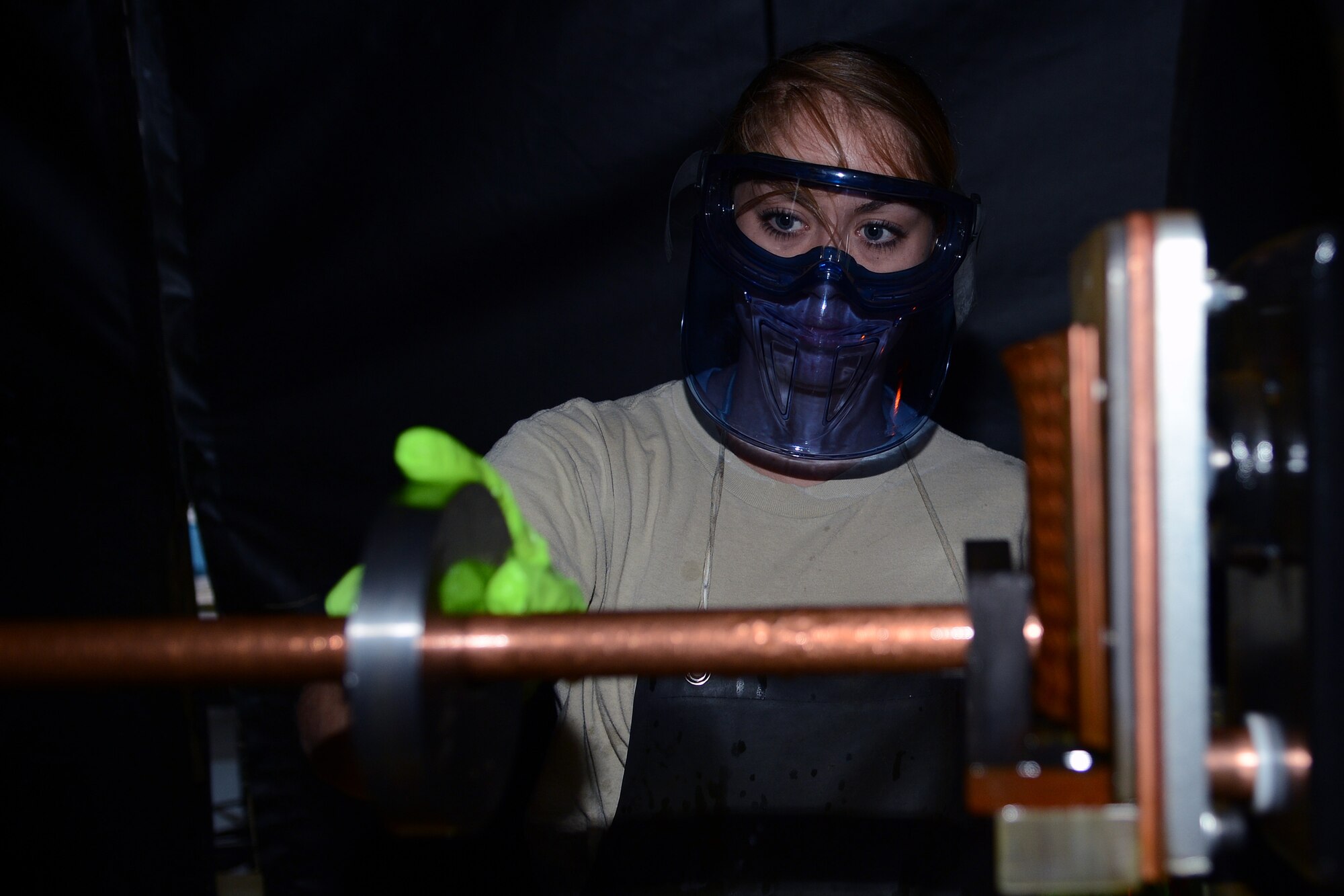 Senior Airman Jazmine Thompson, 446th Maintenance Squadron non-destructive inspection technician, performs a systems effectiveness check on a Ketos ring Aug. 25, 2014, at Joint Base Lewis-McChord, Wash. NDI is responsible for performing inspections of aircraft structural components to identify damages at a microscopic level; damages such as water intrusion, delamination, and cracks of any nature or size. (U.S. Air Force photo/Airman 1st Class Jacob Jimenez) 