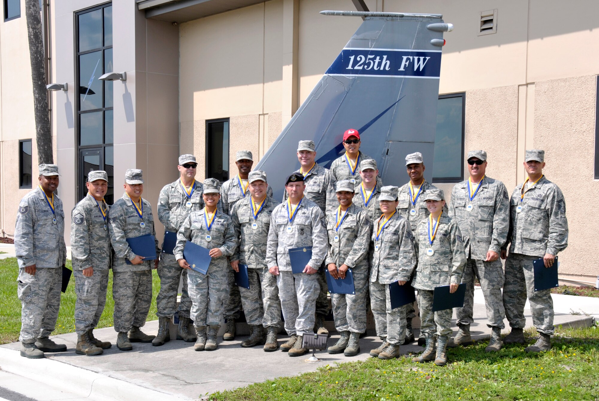 CCAF Graduates pose for a group photo after the CCAF graduation held at the 125th Fighter Wing, Jacksonville Fla. on August 16, 2014. (U.S. Air Force photo by AB Nitza Muniz)