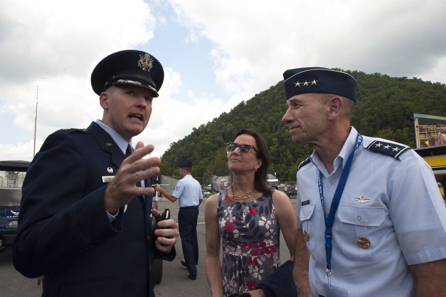 U.S. Air Force Lt. Col. Richard Mendez, left, 332th Recruiting Squadron commander, prepares Lt. Gen. James Holmes, Headquarters U.S. Air Force Deputy Chief of Staff for Strategic Plans and Requirements, for the Delayed Enlistment Program swear-in ceremony at the Bristol Motor Speedway in Bristol, Tenn., Aug. 23, 2014. The Air Force’s involvement in NASCAR allows Air Force Recruiting Service to meet its mission to inspire the nation’s brightest, most competitive young men and women for service. (U.S. Air Force photo by Airman Dillian Bamman/Released)