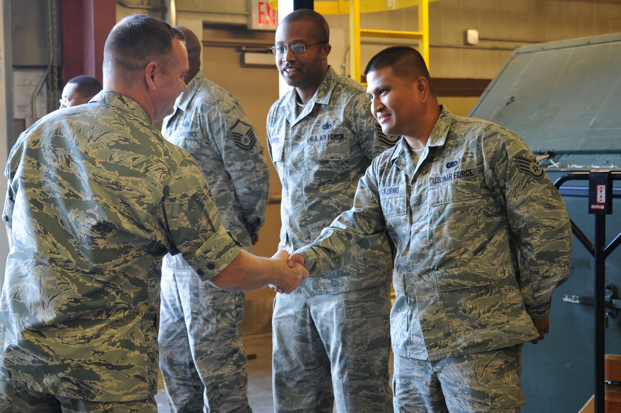 Col. Brian McDaniel greets Airmen of the 92nd Logistics Readiness Squadron during the colonel’s 92nd Mission Support Group immersion at Fairchild Air Force Base, Washington, Aug. 26, 2014. McDaniel took command of the 92nd Air Refueling Wing on July 25, 2014, becoming the new leader of Fairchild's host wing. Immersions are designed to familiarize new leadership with what Airmen in the wing do on a daily basis. (U.S. Air Force photo by Airman 1st Class Janelle Patiño/Released)