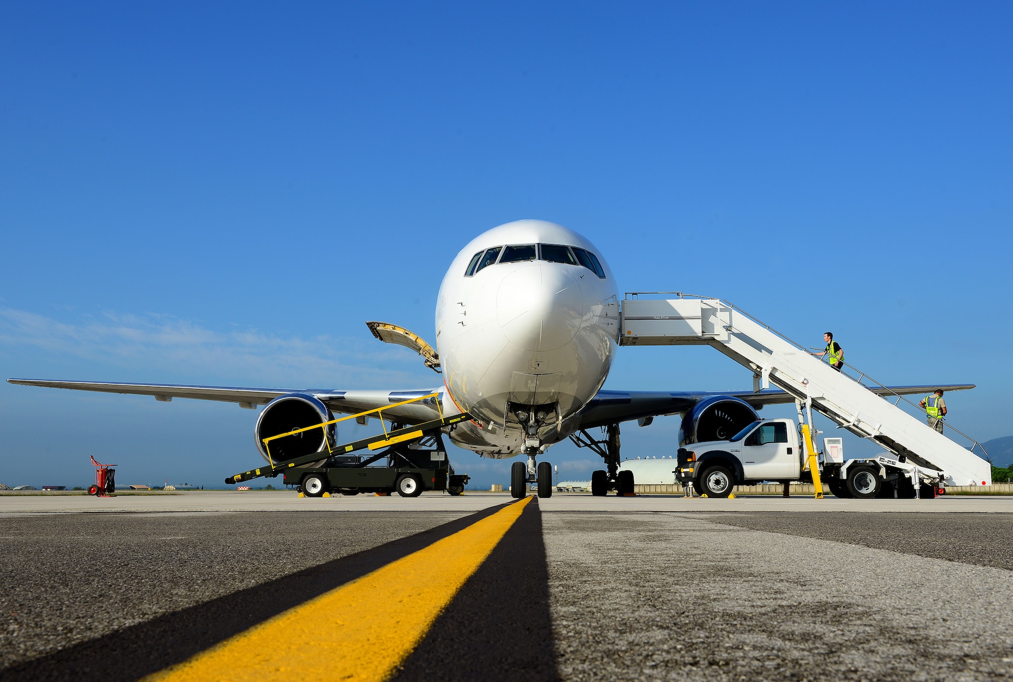 The Boeing 767, also known as the rotator, comes to Aviano Air Base, Italy, weekly to drop off and pick up Team Aviano members that are making a permanent change of station, going on leave, temporary duties or even, deploying. The rotator is under a contract with the military and also allows service members and families an alternate way to return to the states by using the Space-Available program. (U.S. Air Force photo/Senior Airman Matthew Lotz)