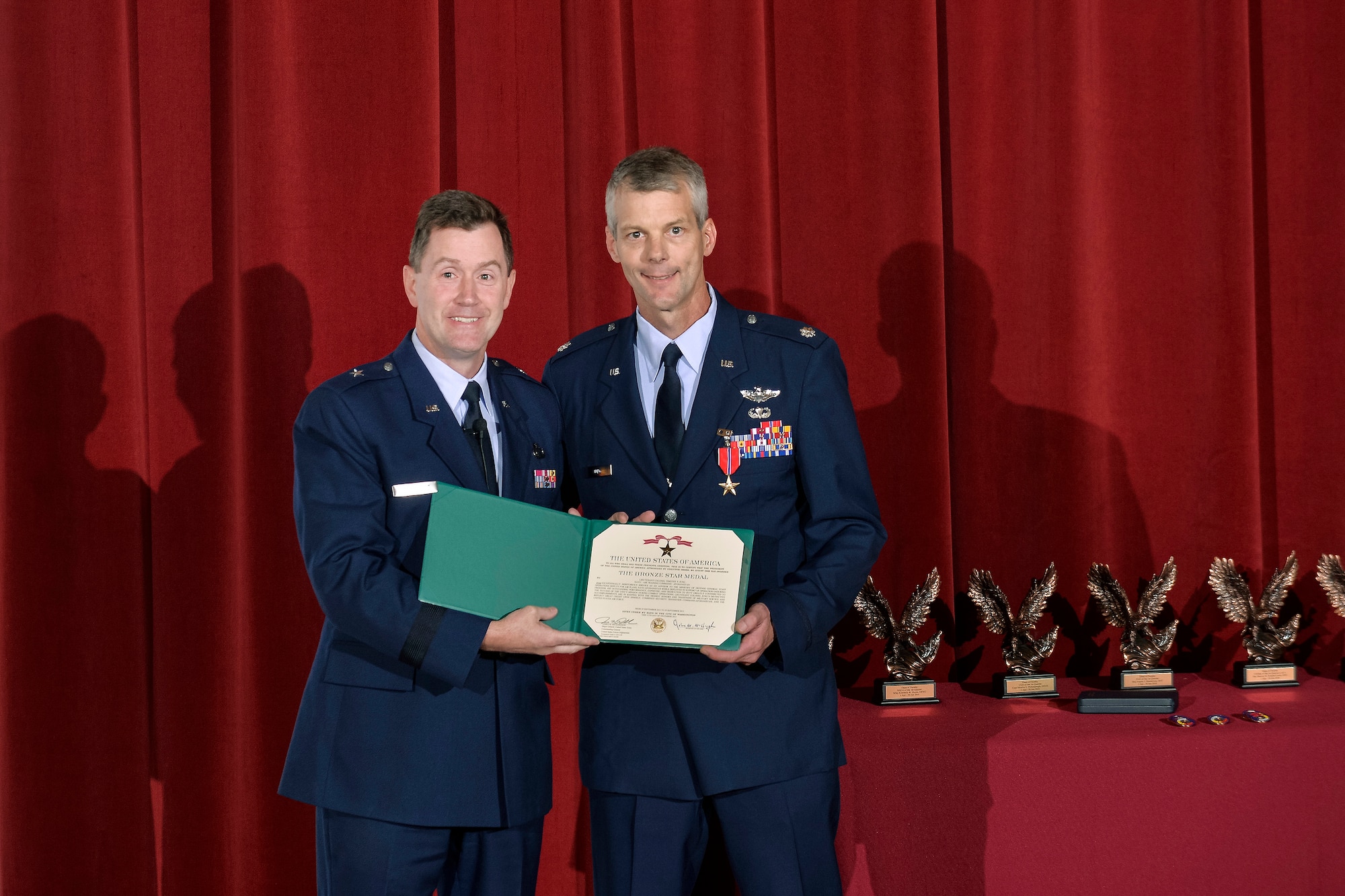 Brig. Gen. Andrew Armacost presents Lt. Col. Tim Jung the Bronze Star for meritorious service during a deployment to Afghanistan in 2012-2013.