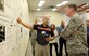 Mike Comfort, the 550th Commodities Maintenance Squadron’s Stock Record Account Number manager, briefs Oklahoma City Air Logistics Complex Commander Brig. Gen. Gene Kirkland about the development of the Consolidated Engine Management System Training guide and how it has been an effective process improvement in their area. During General Kirkland’s “Walk the Wall” visit to the Cruise Missile Shop, other members of the 76th Commodities Maintenance Group also briefed the general about how they have implemented processes promoting the AFSC Way into their daily work routines and how it has positively impacted their workflow. (Air Force photo by Kelly White)