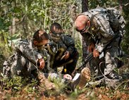 Army Ranger students discuss maneuvers in the woods of the Eglin Air Force Base, Fla., range.  Students complete the final phase of the Army Ranger course with the 6th Ranger Training Battalion.  Instructors expose the students to 18-day field training that includes airborne and helicopter assaults, small boat operations, river and swamp crossings.  (U.S. Air Force photo/Tech. Sgt. Samuel King Jr.)