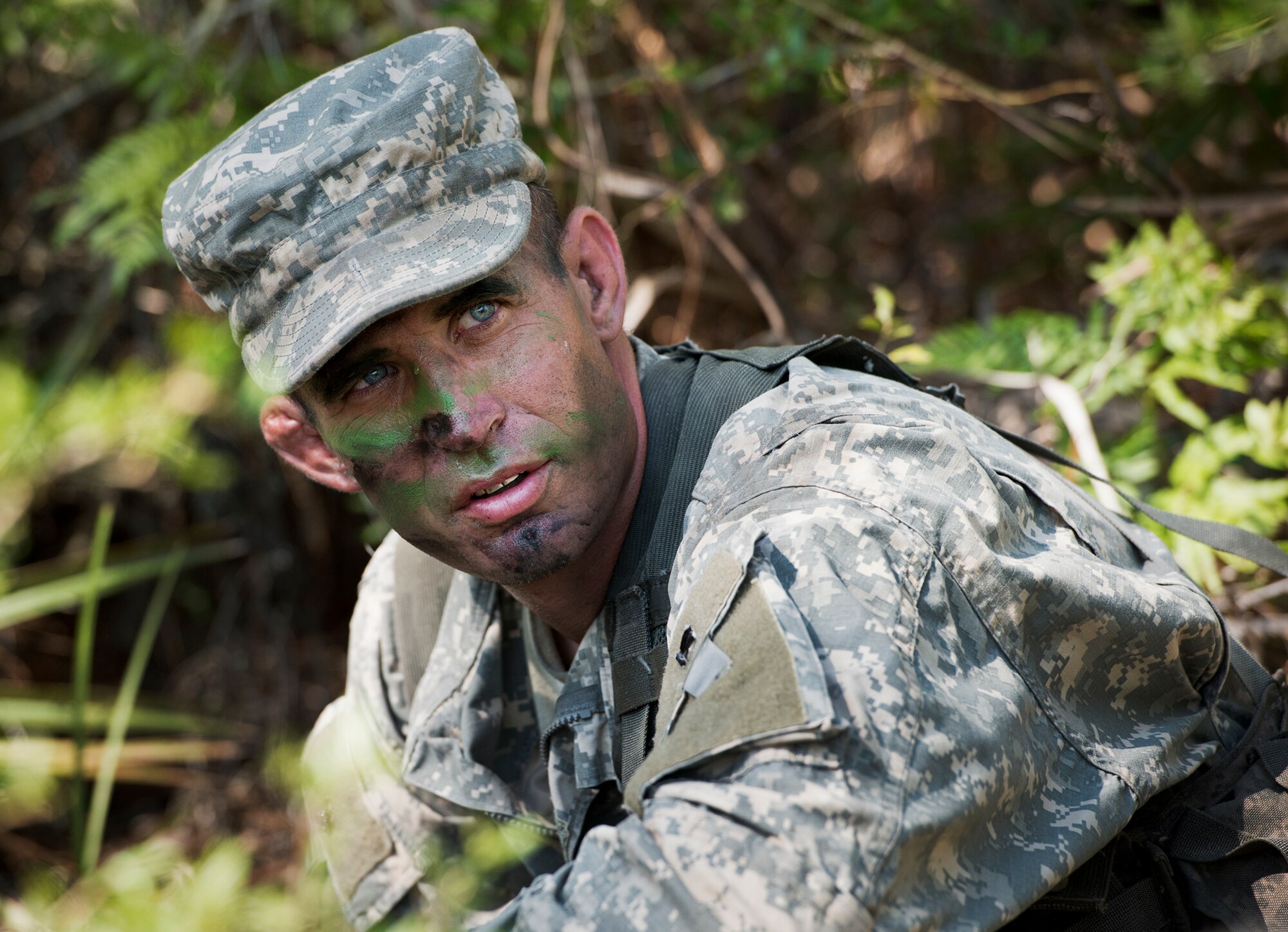 An Army Ranger student takes a breather during a moment of down time prior to a field training exercise in the woods of the Eglin Air Force Base, Fla., range.  Students complete the final phase of the Army Ranger course with the 6th Ranger Training Battalion.  Instructors expose the students to 18-day field training that includes airborne and helicopter assaults, small boat operations, river and swamp crossings. (U.S. Air Force photo/Tech. Sgt. Samuel King Jr.)
