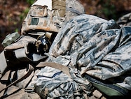 An Army Combat copy of the New Testament is secured with a Ranger student’s gear in the woods of the Eglin Air Force Base, Fla., range.  Students complete the final phase of the Army Ranger course with the 6th Ranger Training Battalion.  Instructors expose the students to 18-day field training that includes airborne and helicopter assaults, small boat operations, river and swamp crossings. (U.S. Air Force photo/Tech. Sgt. Samuel King Jr.) 