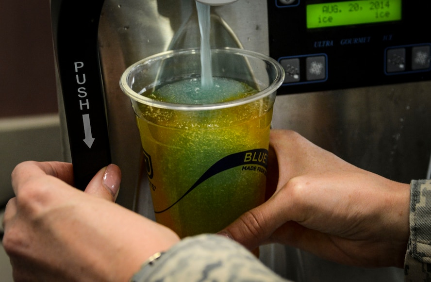 Two slushy flavors are mixed together at the chapel’s free coffee and slushy counter in the McAdoo Sports and Fitness Center on Minot Air Force Base, N.D., Aug. 5, 2014. The counter is open from 7:30 a.m. to 9 a.m. Tuesday, Wednesday and Thursday, and serves approximately 40 Airmen a day. (U.S. Air Force photo/ Senior Airman Stephanie Morris)