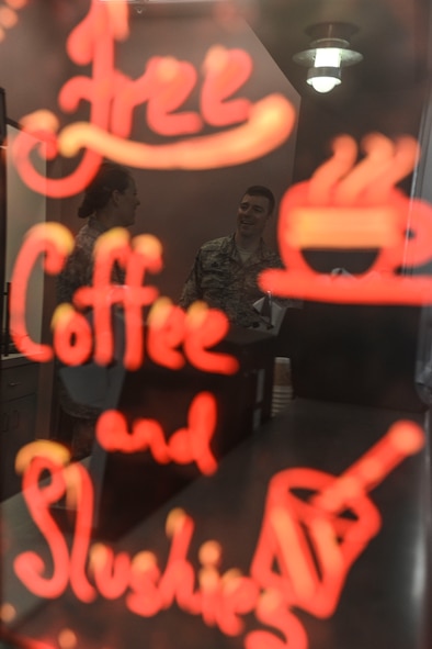 Capt Jayme Kendall, 91st Missile Wing Chaplain and Master Sgt. James Hayes, 5th Bomb Wing chapel assistant, await visitors at the chapel’s coffee and slushy counter in the McAdoo Sports and Fitness Center on Minot Air Force Base, N.D., Aug. 5, 2014. The counter is open from 7:30 a.m. to 9 a.m. Tuesday, Wednesday and Thursday, and offers a variety of free coffee, hot cocoa and two flavors of sports-drink slushies. (U.S. Air Force photo/ Senior Airman Stephanie Morris)
