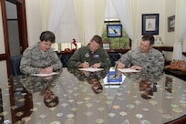Gen. Robin Rand (center), commander of Air Education and Training Command; Maj. Gen. Margaret Poore (left), commander of Air Force Personnel Center; and Col. Michael Romero, acting commander of Air Force Recruiting Service, sign Combined Federal Campaign contribution forms Aug. 19 in preparation for the CFC kick off Tuesday.
(U.S. Air Force photo by Joel Martinez)
