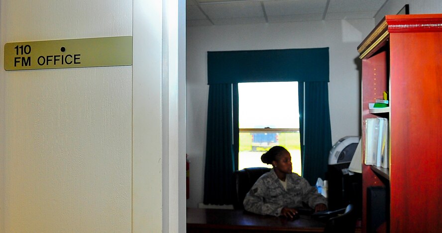 Staff Sgt. Chariesse Garrett, 741st Missile Squadron facility manager, sits in the FM’s office during her shift at a missile alert facility in North Dakota. Each day FMs check water levels and the launch control equipment building to ensure everything is working properly. (U.S. Air Force photo/Senior Airman Brittany Y. Bateman)