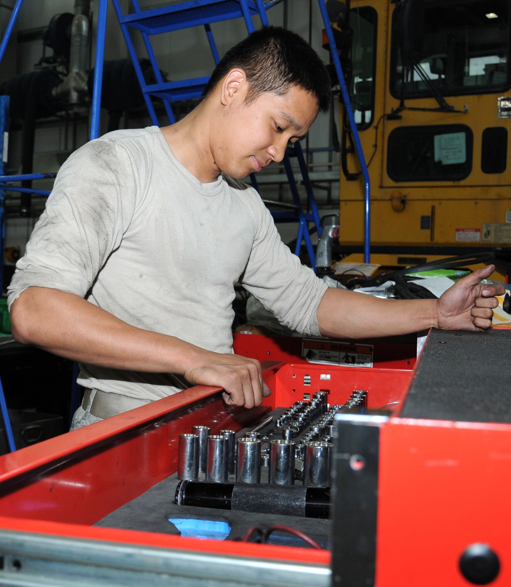 U.S. Air Force Airman 1st Class James Matthew Doligon, 100th Logistics Readiness Squadron Special Purpose Vehicle Maintenance apprentice from Kealakekua, Hawaii, inspects his toolbox to ensure all of his tools are accounted for Aug. 8, 2014, on RAF Mildenhall, England. Doligon’s duties are to troubleshoot and perform preventative maintenance on vehicles to provide Team Mildenhall the most effective and efficient vehicle fleet to meet mission requirements. (U.S. Air Force photo/Gina Randall/Released)