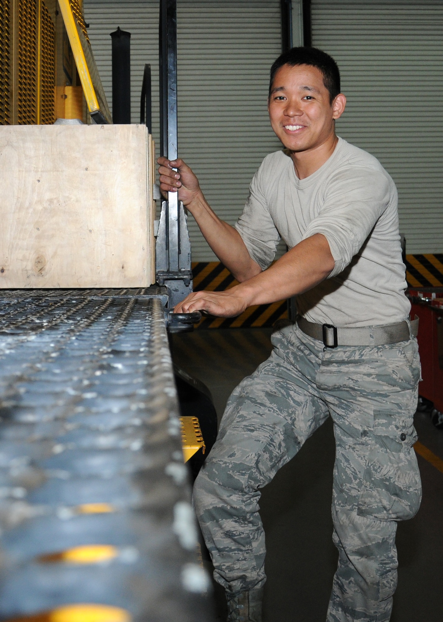 U.S. Air Force Airman 1st Class James Matthew Doligon, 100th Logistics Readiness Squadron Special Purpose Vehicle Maintenance apprentice from Kealakekua, Hawaii, poses for a photograph Aug. 8, 2014, on RAF Mildenhall, England. When Doligon isn’t serving his country in the vehicle management flight, he enjoys music, exploring, snowboarding, outdoor activities and playing video games. (U.S. Air Force photo/Gina Randall/Released)