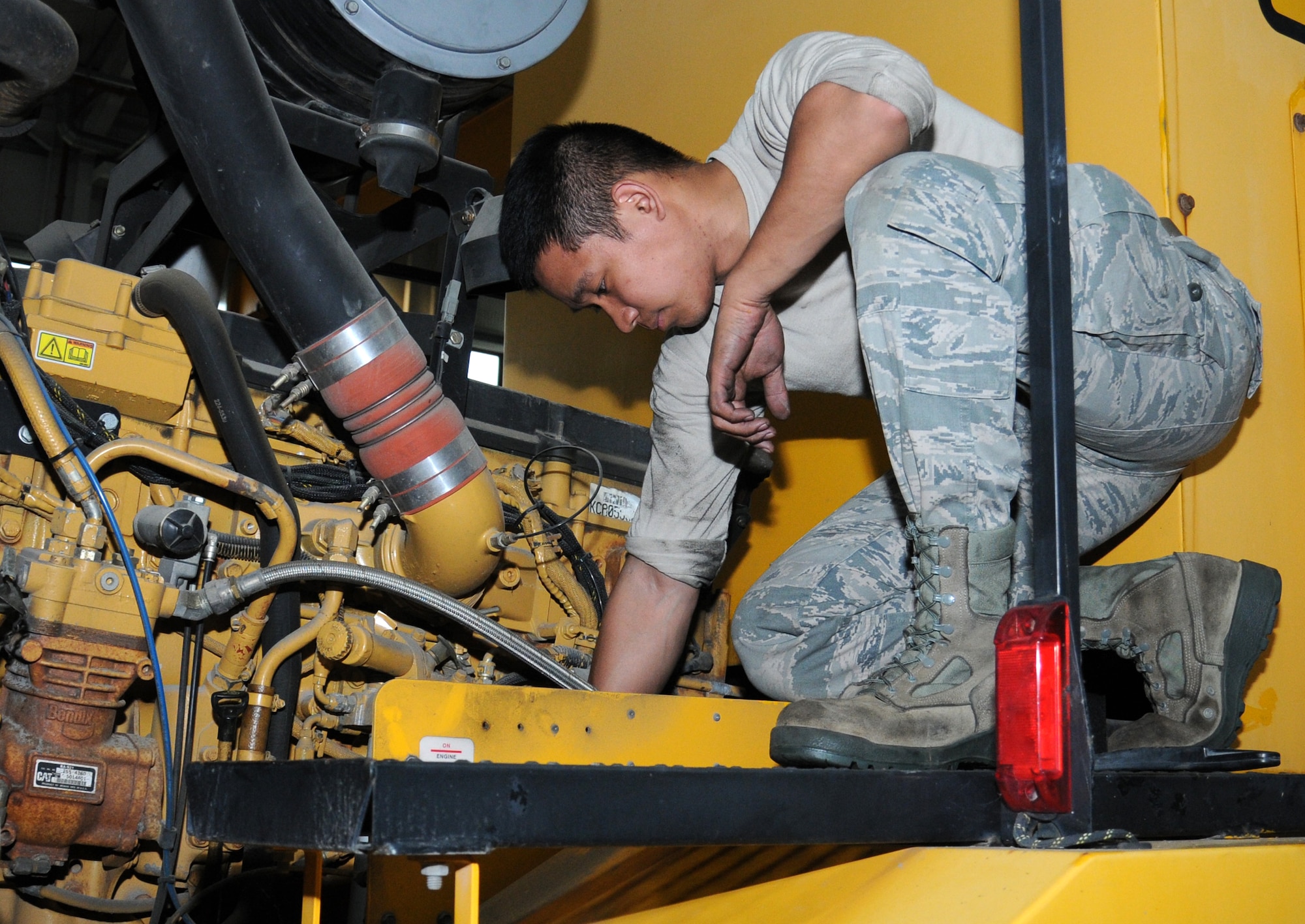 U.S. Air Force Airman 1st Class James Matthew Doligon, 100th Logistics Readiness Squadron Special Purpose Vehicle Maintenance apprentice from Kealakekua, Hawaii, performs an annual preventative maintenance inspection  Aug. 8, 2014, on RAF Mildenhall, England. The vehicle management shop supports many units on base including, the 100th Air Refueling Wing, 95th Reconnaissance Squadron, 727th Air Mobility Squadron, U.S. Air Forces in Europe-United Kingdom, Defense Courier Service and the Office of Special Investigations. (U.S. Air Force photo/Gina Randall/Released)
