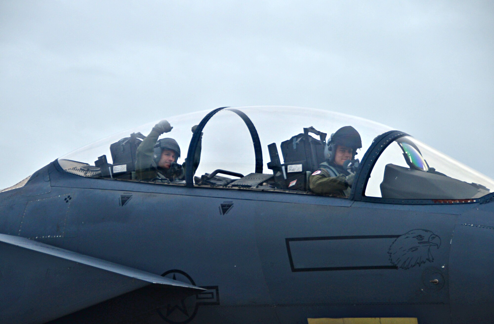 Fighter pilots assigned to the 494th Fighter Squadron, taxi on the runway at Royal Air Force Lakenheath, England, Aug. 25, 2014, after returning from  exercises in the U.S. The 48th Fighter Wing F-15E Strike Eagles returned after participating in Red Flag exercise 14N-3 at Nellis Air Force Base, Nev., and the Combat Hammer and Combat Archer exercises at Hill Air Force Base, Utah. (U.S. Air Force photo by Airman 1st Class Erin O’Shea/Released) 