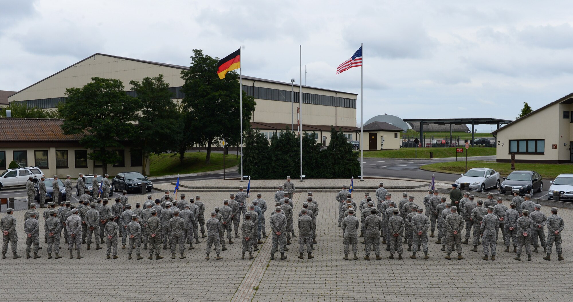 Airmen of the 52nd Fighter Wing stand in formation for a retreat ceremony at Spangdahlem Air Base, Germany, Aug. 25th, 2014.  The 52nd FW conducts the ceremony once a month to build camaraderie among its units. (U.S. Air Force photo by Airman 1st Class Kyle Gese/Released)