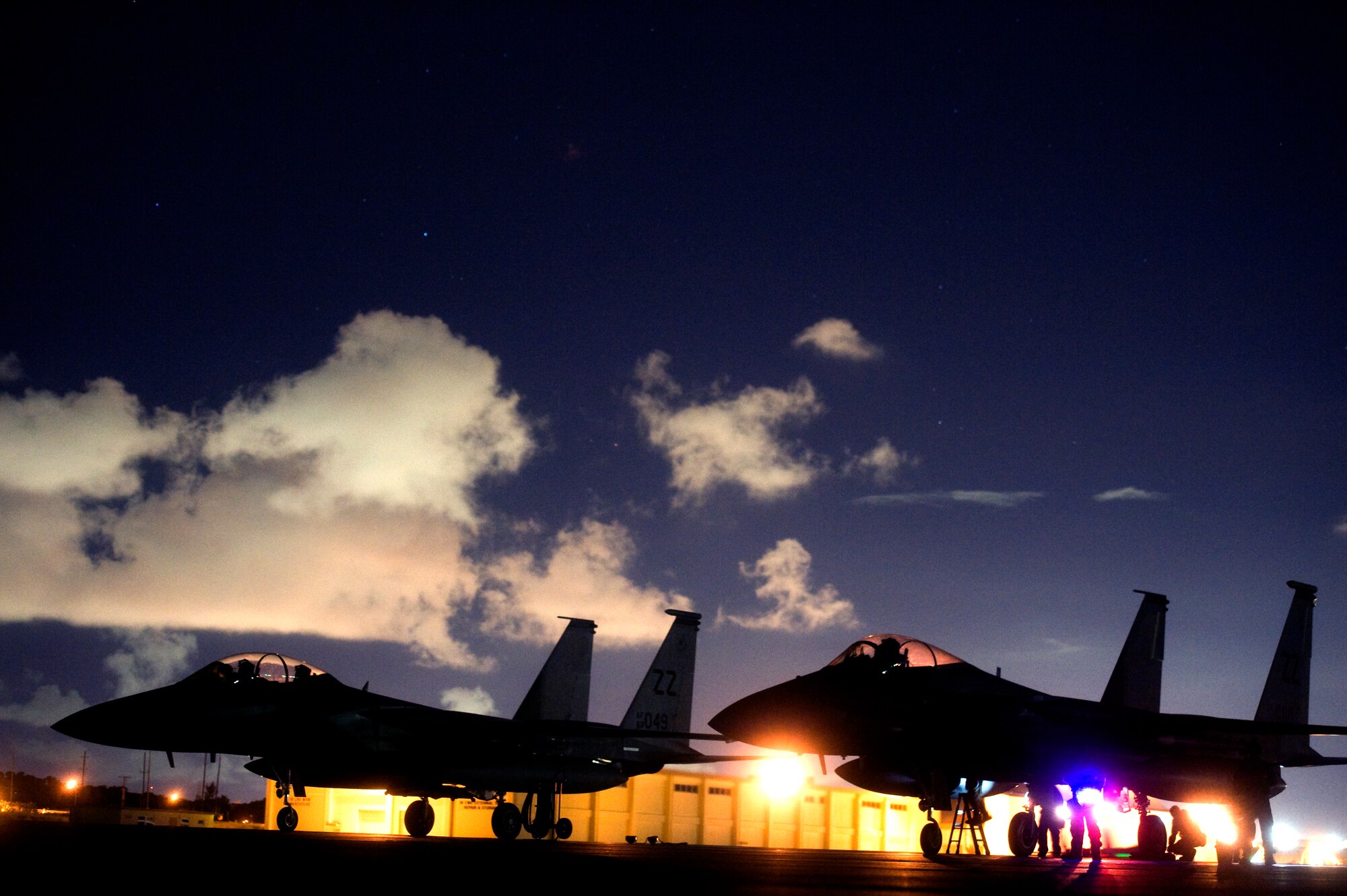Two U.S. Air Force F-15C Eagles await post-flight inspections during a hung munitions exercise as part of a mission focused exercise on Kadena Air Base, Japan, Aug. 21, 2014. Eagles are highly maneuverable, twin-engine fighter jets designed to aid the Air Force in achieving air dominance against an enemy. During MFEs, Airmen train to respond to a multitude of scenarios in order to increase combat readiness and the ability to operate effectively in a hostile environment. (U.S. Air Force photo by Senior Airman Maeson L. Elleman)