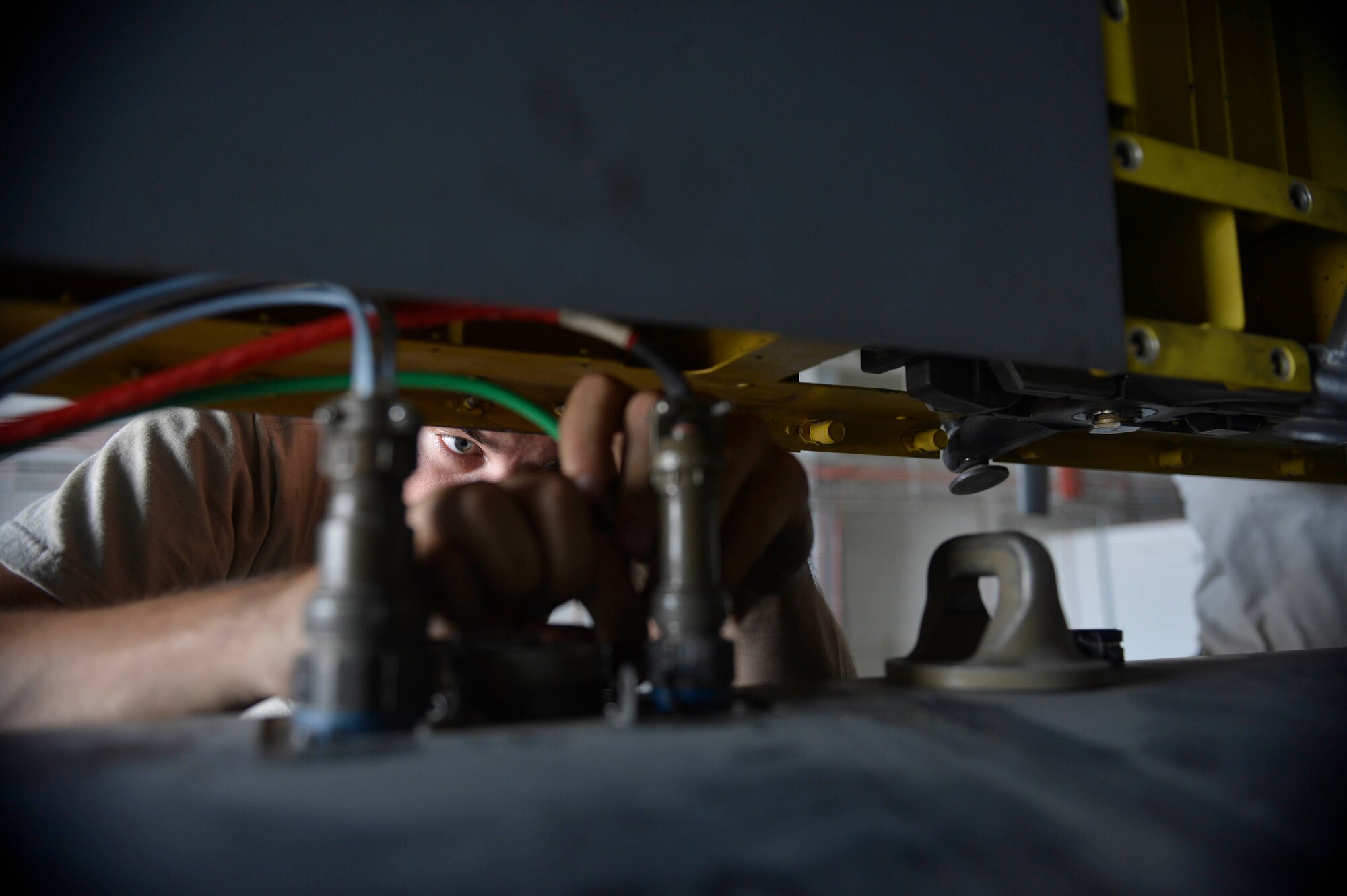 U.S. Air Force Senior Airman Jessie Mechling, 41st Expeditionary Electronic Combat Squadron electronic warfare systems journeyman, performs electrical maintenance on an EC-130H Compass Call aircraft at Bagram Airfield, Afghanistan Aug. 25, 2014.  Electronic warfare systems journeymen are responsible for performing maintenance on avionic electronic warfare and analysis equipment. Mechling is deployed from Davis-Monthan Air Force Base, Ariz. and a native of Martinez, Calif. (U.S. Air Force photo by Staff Sgt. Evelyn Chavez/Released)